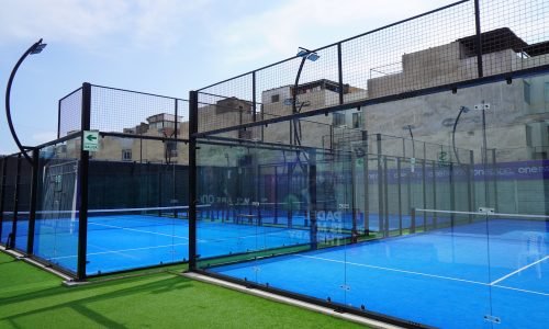 a tennis court with a fence surrounding it
